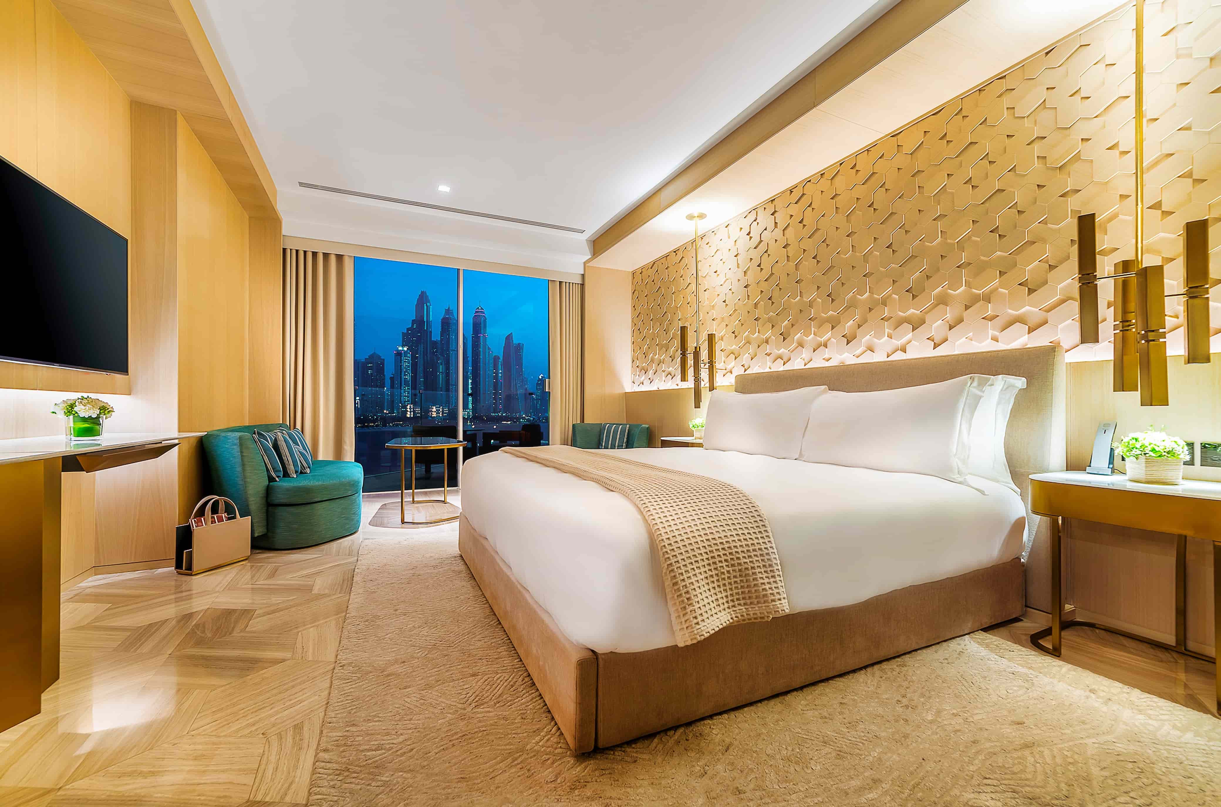Luxe Sea View room interior with king bed and balcony at FIVE Palm Jumeirah Dubai