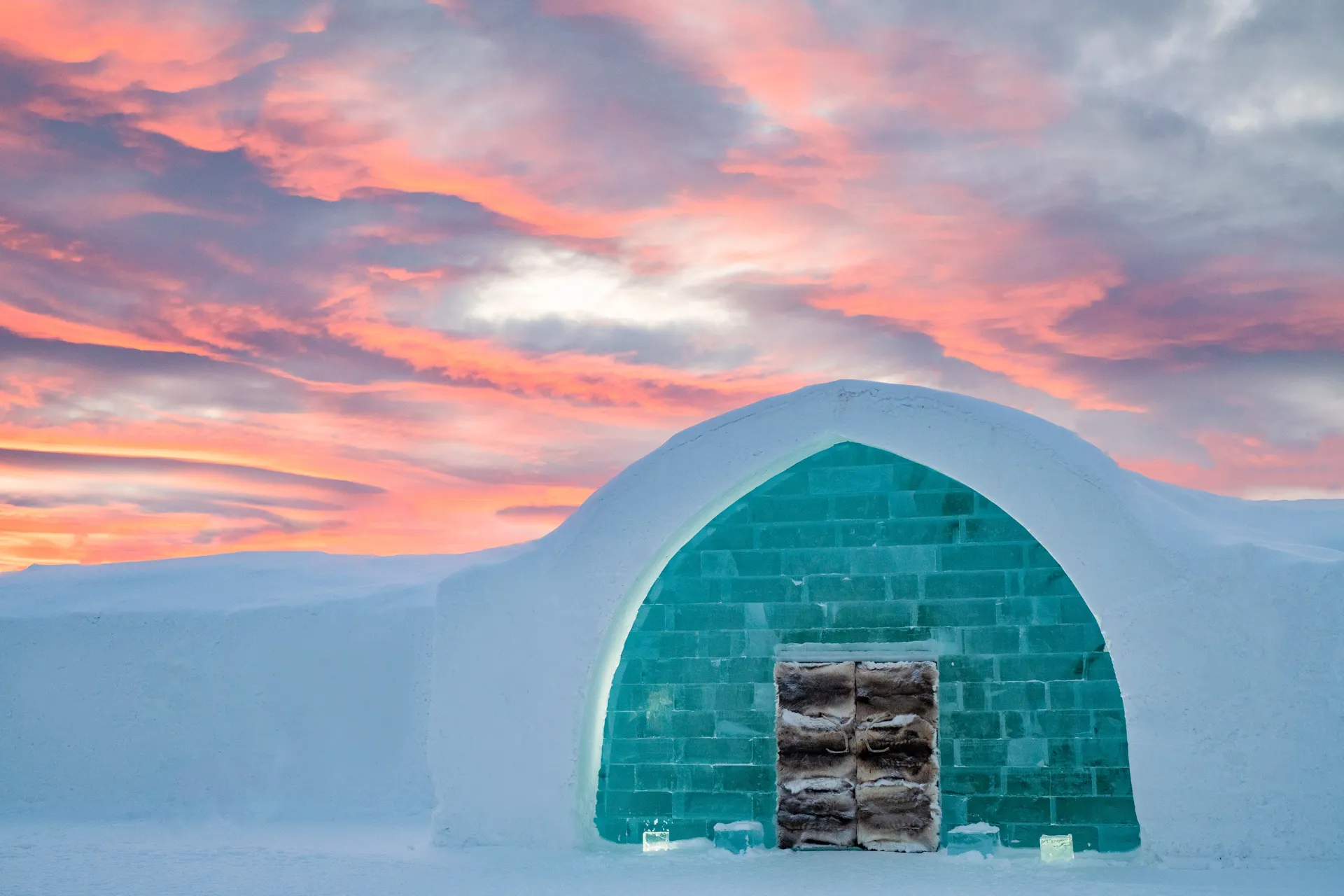 ICEHOTEL Sweden's frozen façade under the aurora borealis, rebuilt annually from Torne River ice