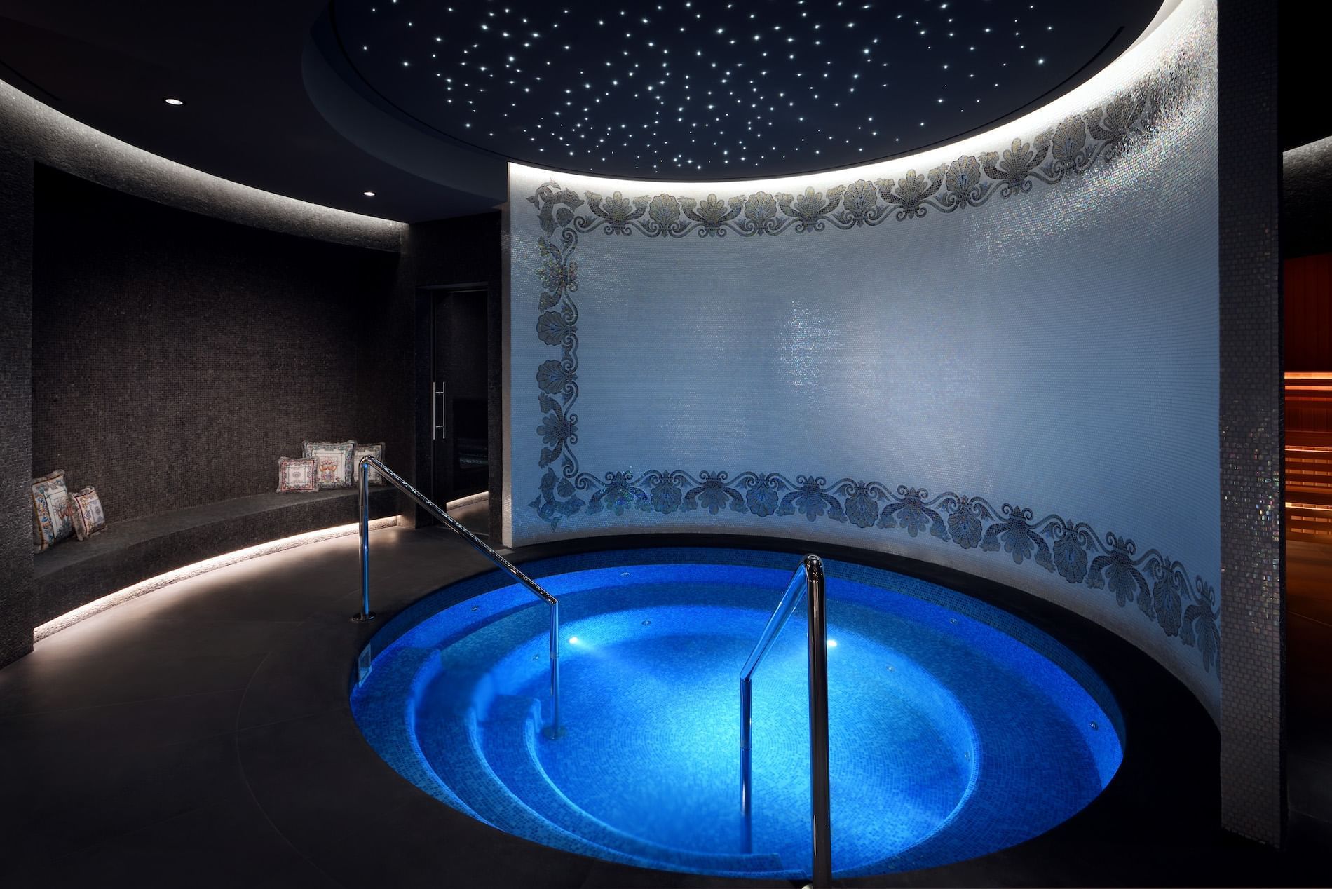 The plunge pool area with ambient lighting in the spa at Palazzo Versace Dubai
