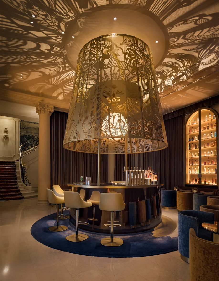 The stunning zodiac-themed Ritz Bar at Ritz Paris, featuring a monumental brass lantern and celestial decor.