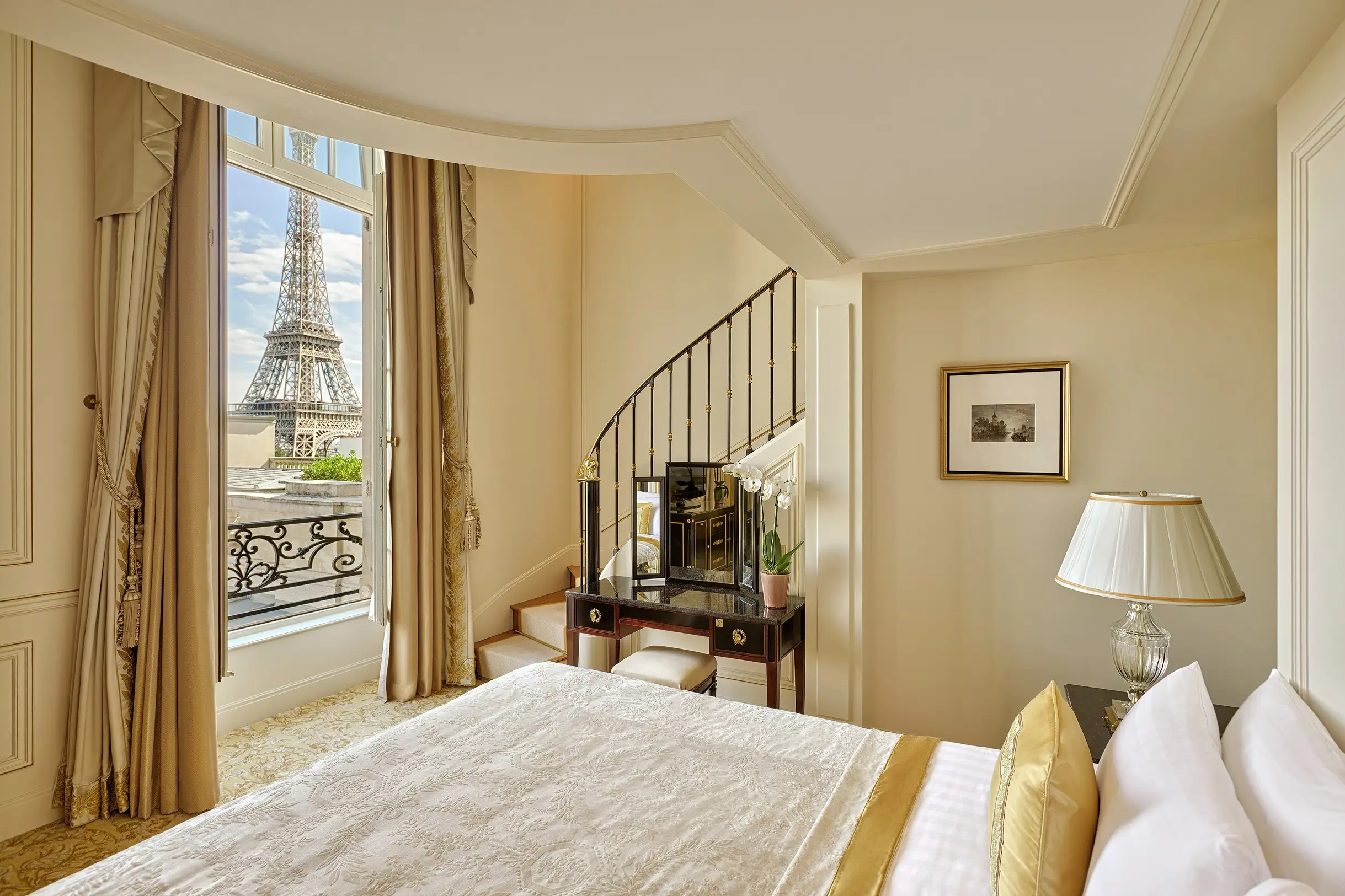 Soak in panoramic views from the spacious Duplex Eiffel View Suite.
