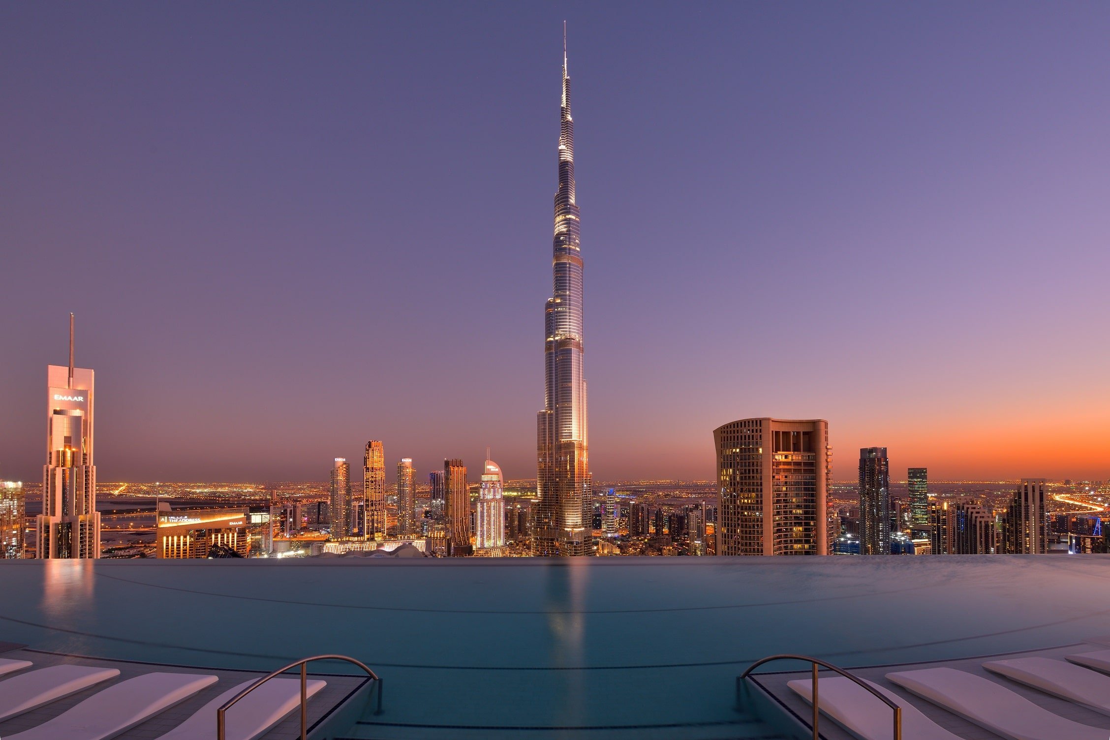 The infinity pool at Address Sky View frames a direct view of the Burj Khalifa at sunset.