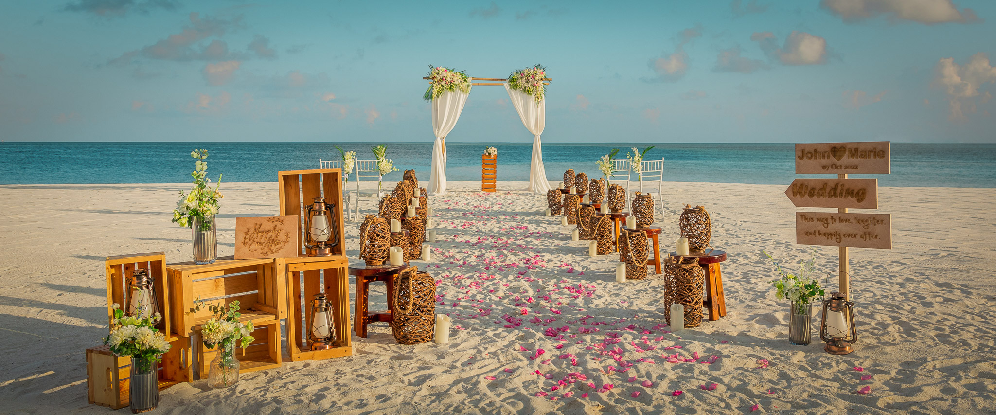Deluxe Beach wedding ceremony setup at Conrad Maldives Rangali Island.