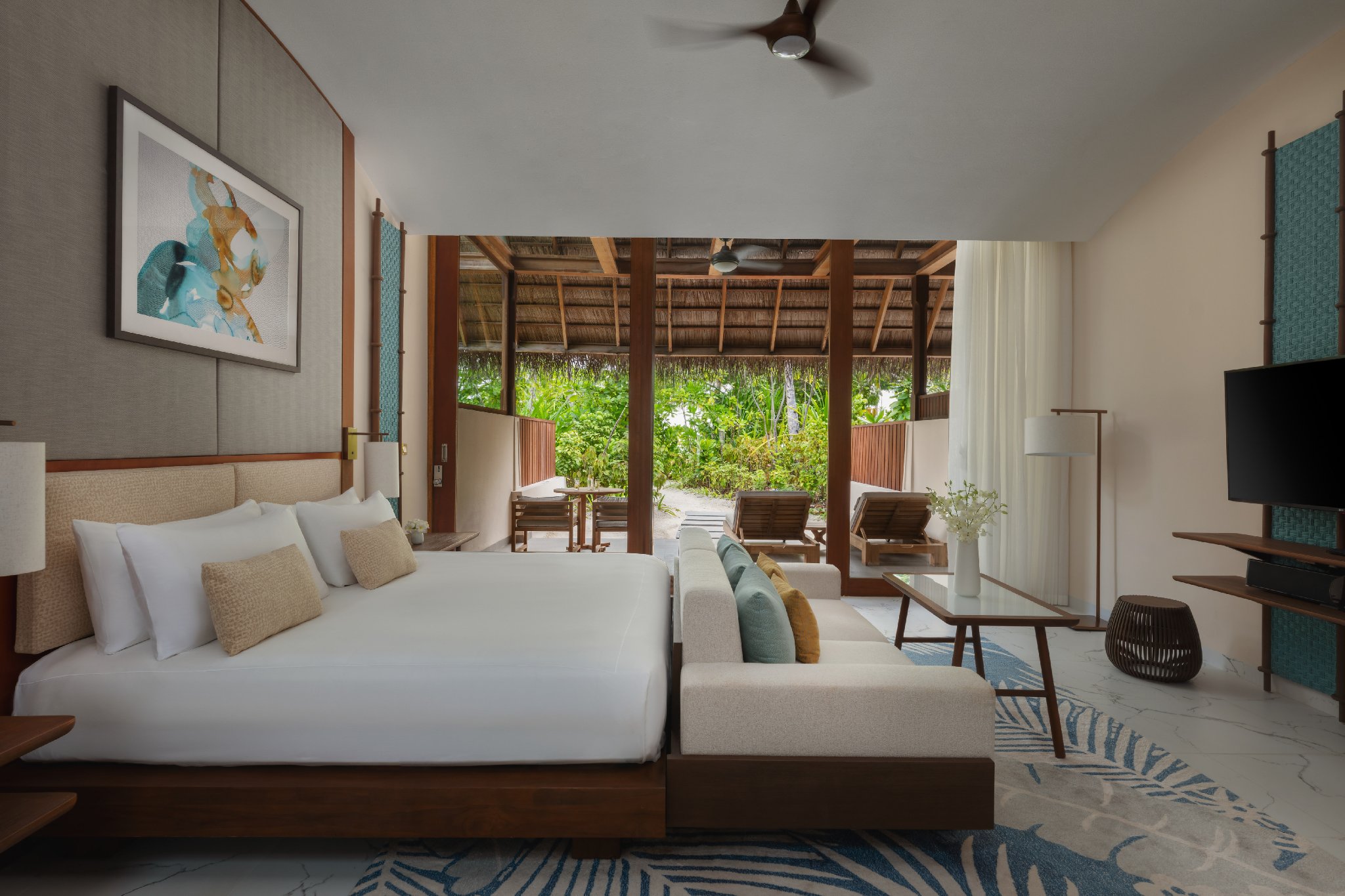 Spacious bedroom interior of a Family Beach Villa at Conrad Maldives.