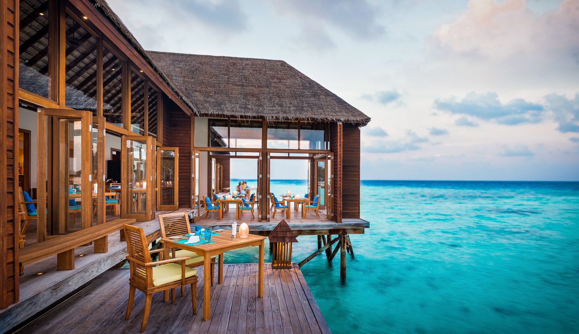 Mandhoo Spa Restaurant deck over the lagoon at Conrad Maldives.