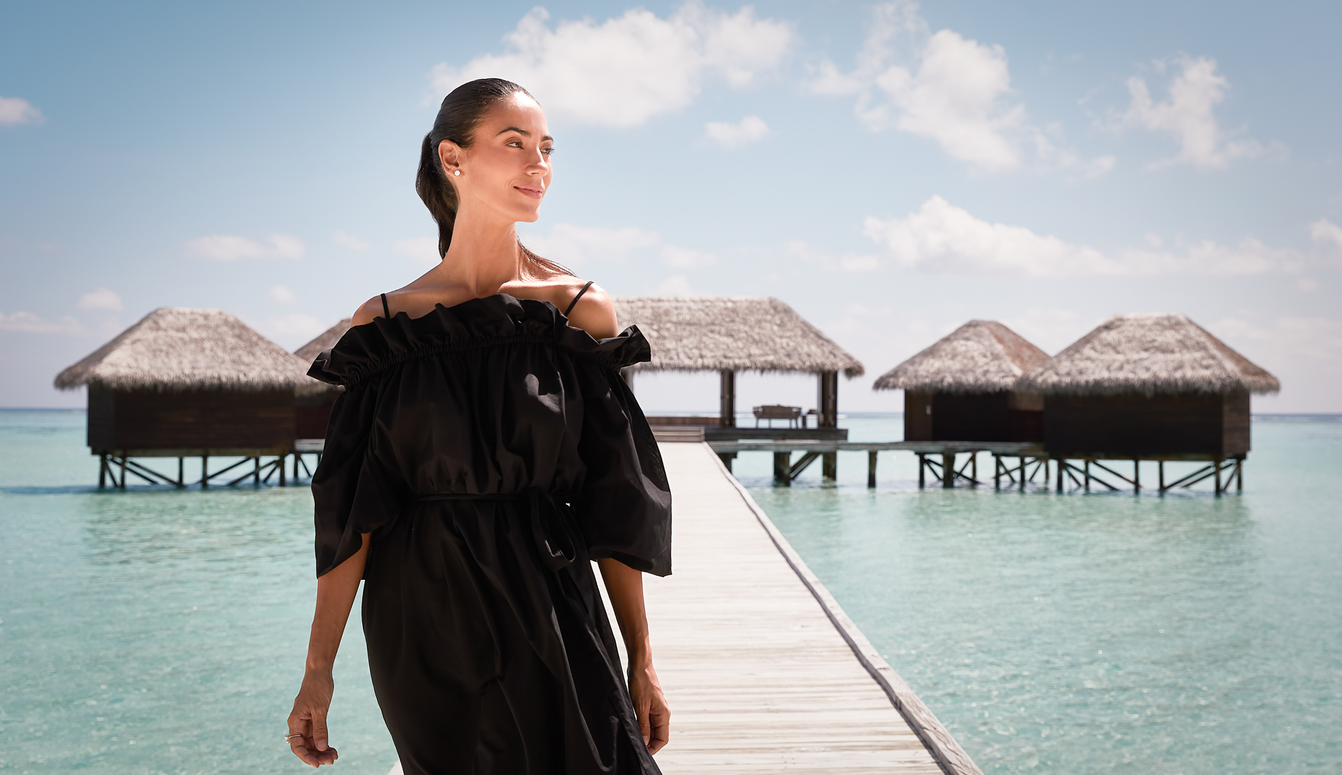 The overwater pathway leading to the Spa Retreat at Conrad Maldives.