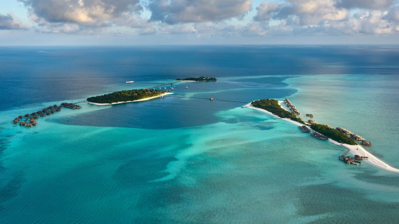 Aerial view of Conrad Maldives Rangali Island showing the twin islands connected by a bridge.