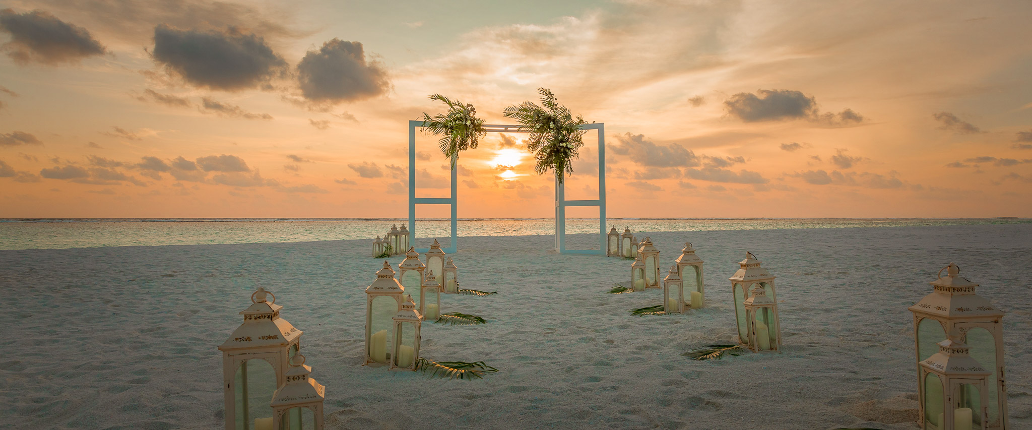 Sunset Tip Beach wedding venue with ocean backdrop at Conrad Maldives.