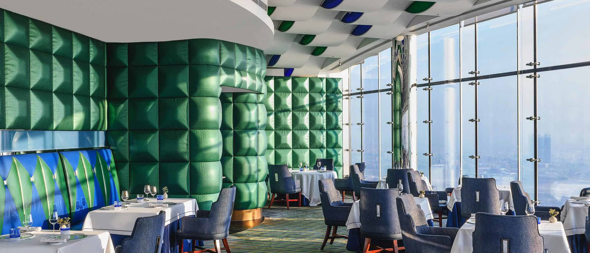 The sophisticated and elegant interior of the Michelin-starred Al Muntaha restaurant.