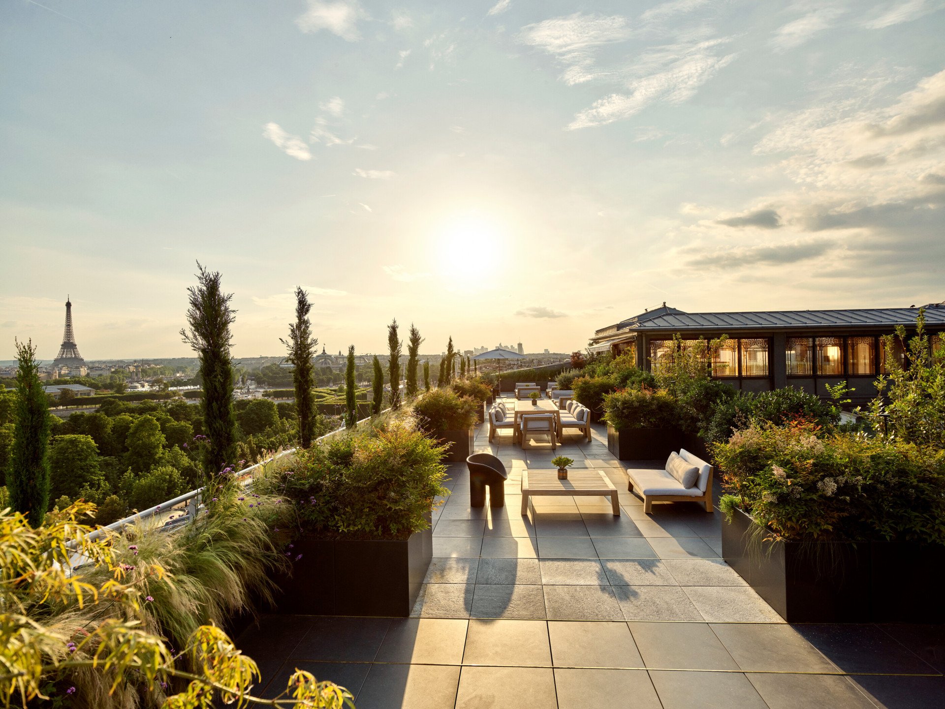 The wraparound terrace of the Belle Etoile Penthouse Suite at Le Meurice, offering a 360-degree view of Paris.