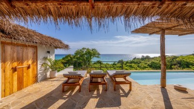 Private plunge pool and sun deck of an Oceanview Villa at The Manta Resort, overlooking the turquoise waters of the Pemba Channel.