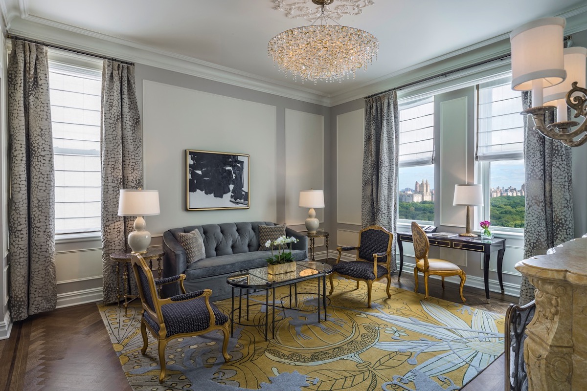 The living room in the Carnegie Partial Park View Two Bedroom Suite, offering luxury accommodations.