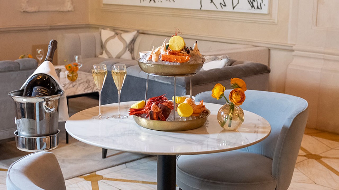A luxurious seafood tower presentation at The Champagne Bar, paired with fine champagne.