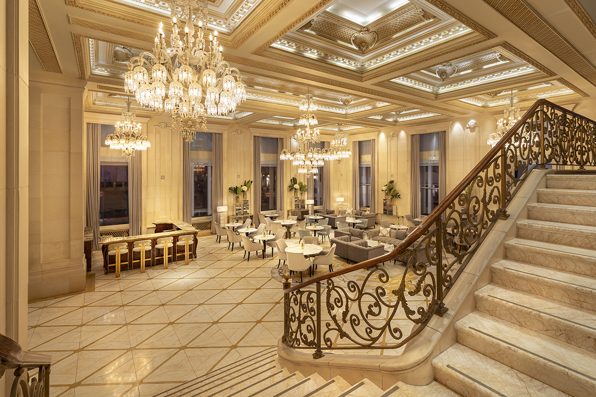 The elegant Champagne Bar at The Plaza Hotel, offering views of Fifth Avenue and Pulitzer Fountain.