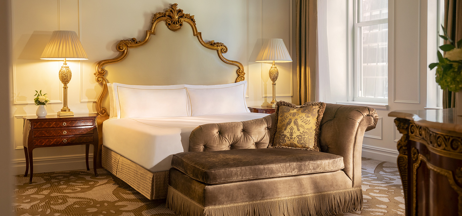 The Edwardian One Bedroom Suite King bedroom at The Plaza Hotel, featuring elegant decor and luxurious bedding.