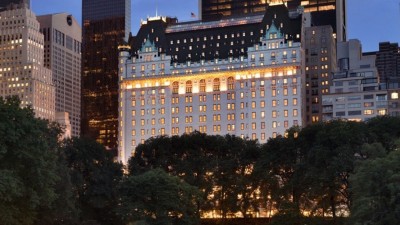 The Plaza Hotel's exterior at sunset, highlighting its iconic architecture on Fifth Avenue.