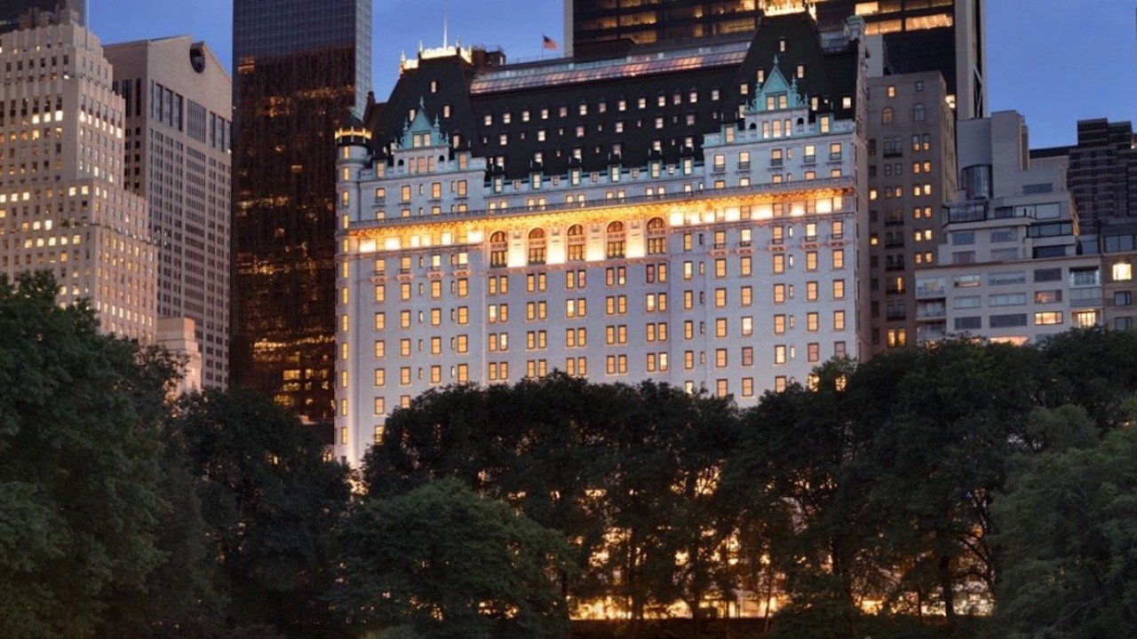 The Plaza Hotel's exterior at sunset, highlighting its iconic architecture on Fifth Avenue.