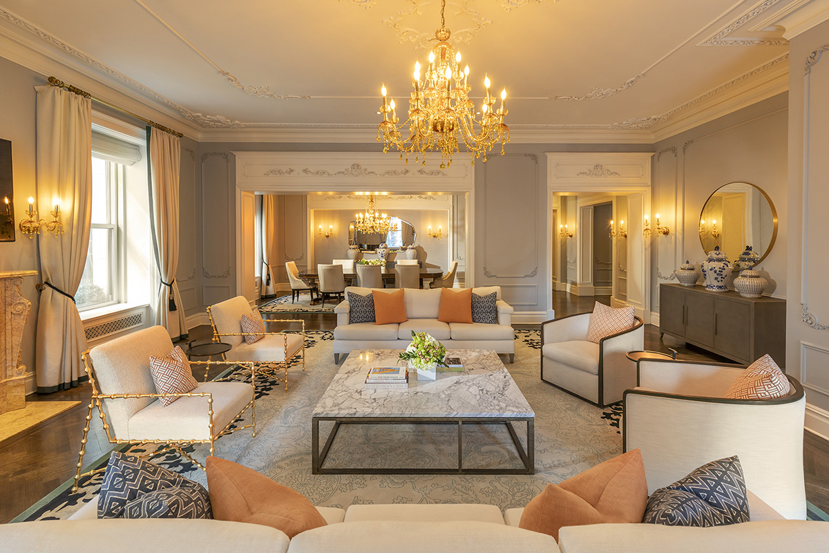 The grand living room in the Royal Suite, featuring a piano and elegant decor for prestigious events.