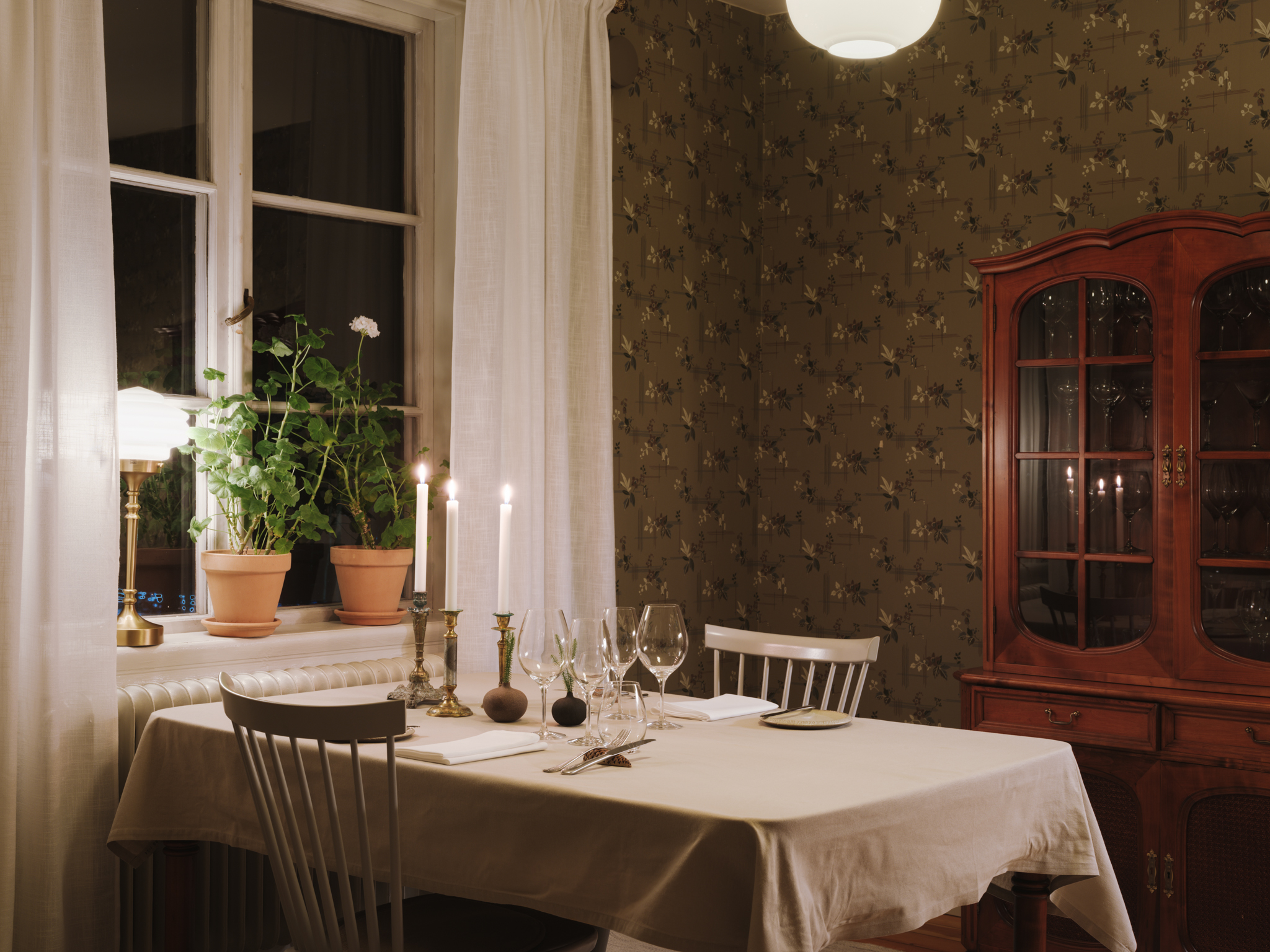 A beautifully set table at Treehotel's restaurant, showcasing Scandinavian cuisine in a rustic yet elegant setting.