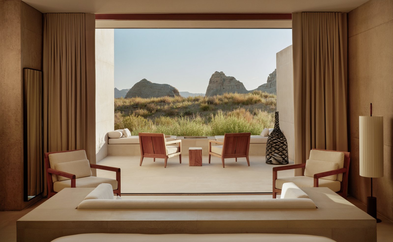 The bedroom in the Amangiri Suite, featuring a king-size bed and a vast desert vista.