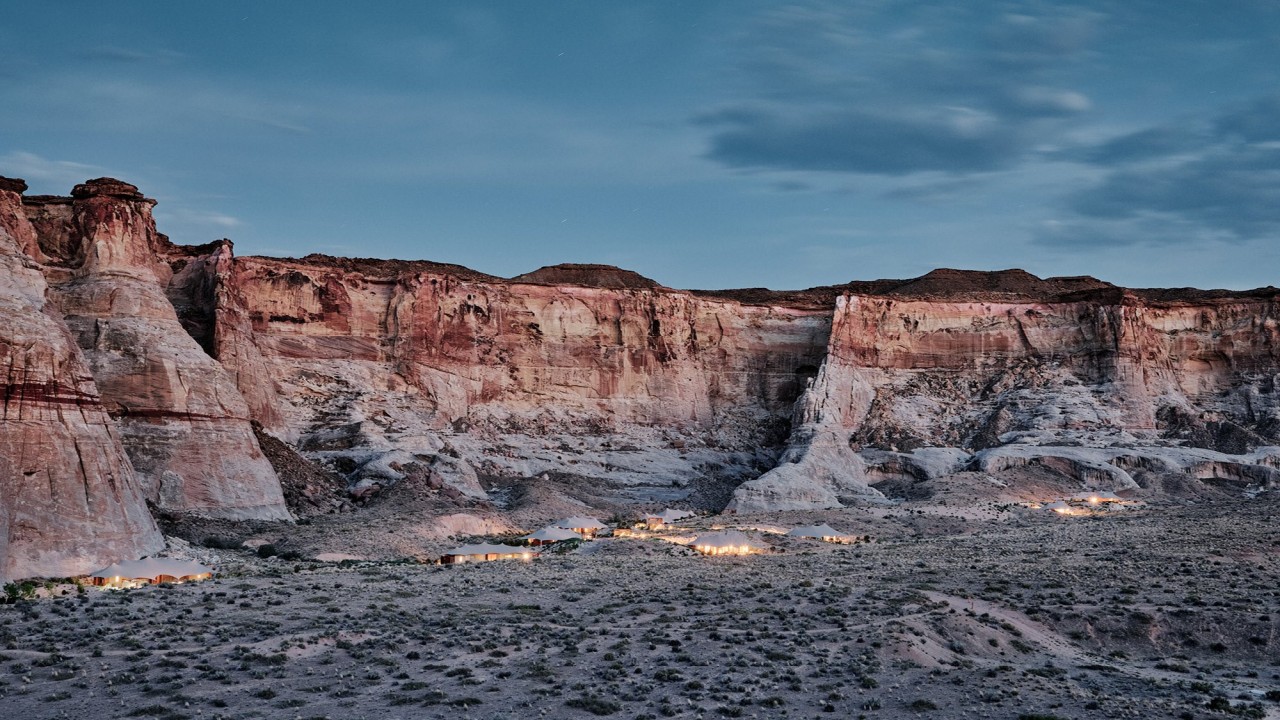 A view of Camp Sarika's tented pavilions set against the rugged desert landscape of southern Utah.