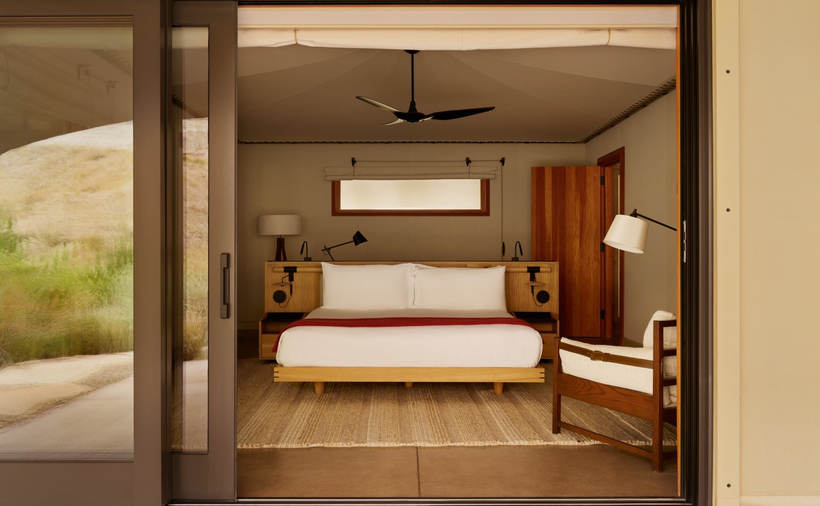 The spacious and elegant bedroom of a Two-Bedroom Tented Pavilion at Camp Sarika.