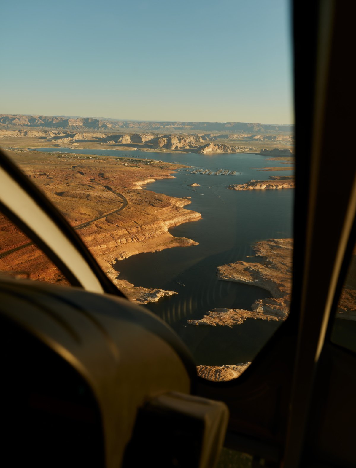 A scenic helicopter tour over Lake Powell, showcasing the vast blue waters against the red-rock landscape.