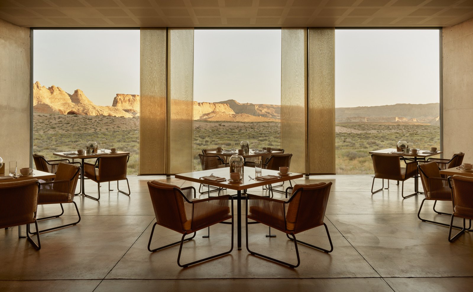 The elegant interior of the main restaurant at Amangiri Resort, with floor-to-ceiling desert views.