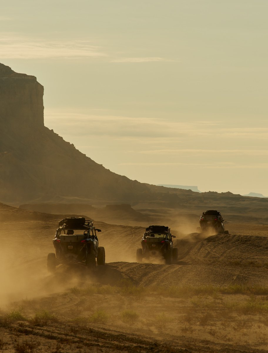 UTVs exploring the untouched, moon-like landscapes of the Red Rock Country near Camp Sarika.
