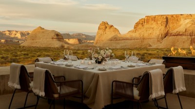 An elegantly set table for a wedding celebration at Amangiri, with the desert landscape as a backdrop.
