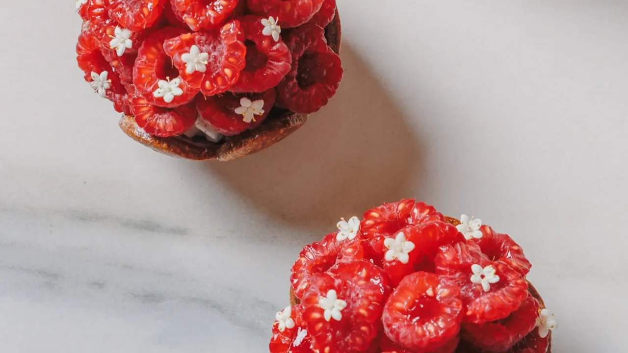 An elegant fruit and cream-based pastry, showcasing modern techniques.