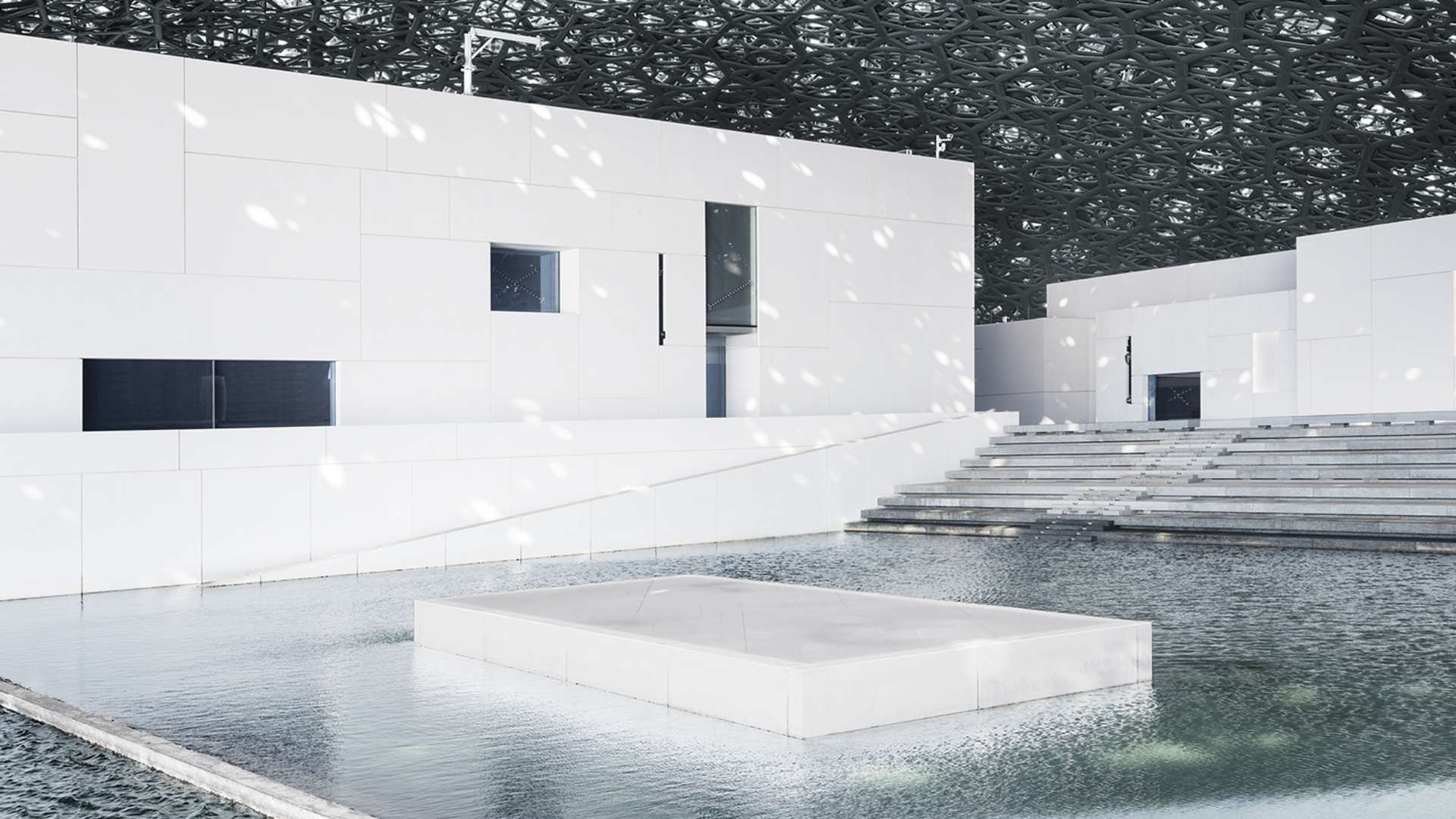 The iconic architecture of Louvre Abu Dhabi, part of the cultural tour experiences from Bvlgari Resort Dubai.