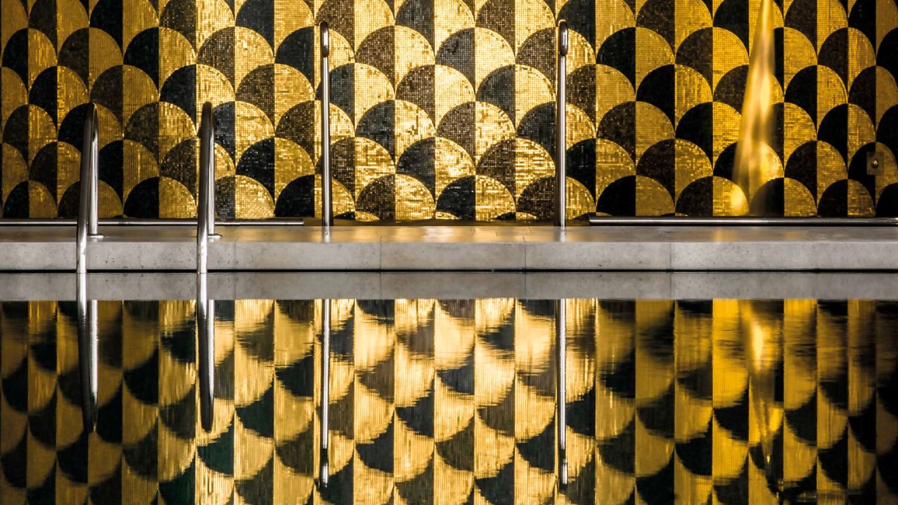 The elegant vitality pool at Bvlgari Spa Dubai, featuring Roman bath-inspired design with contemporary luxury finishes.