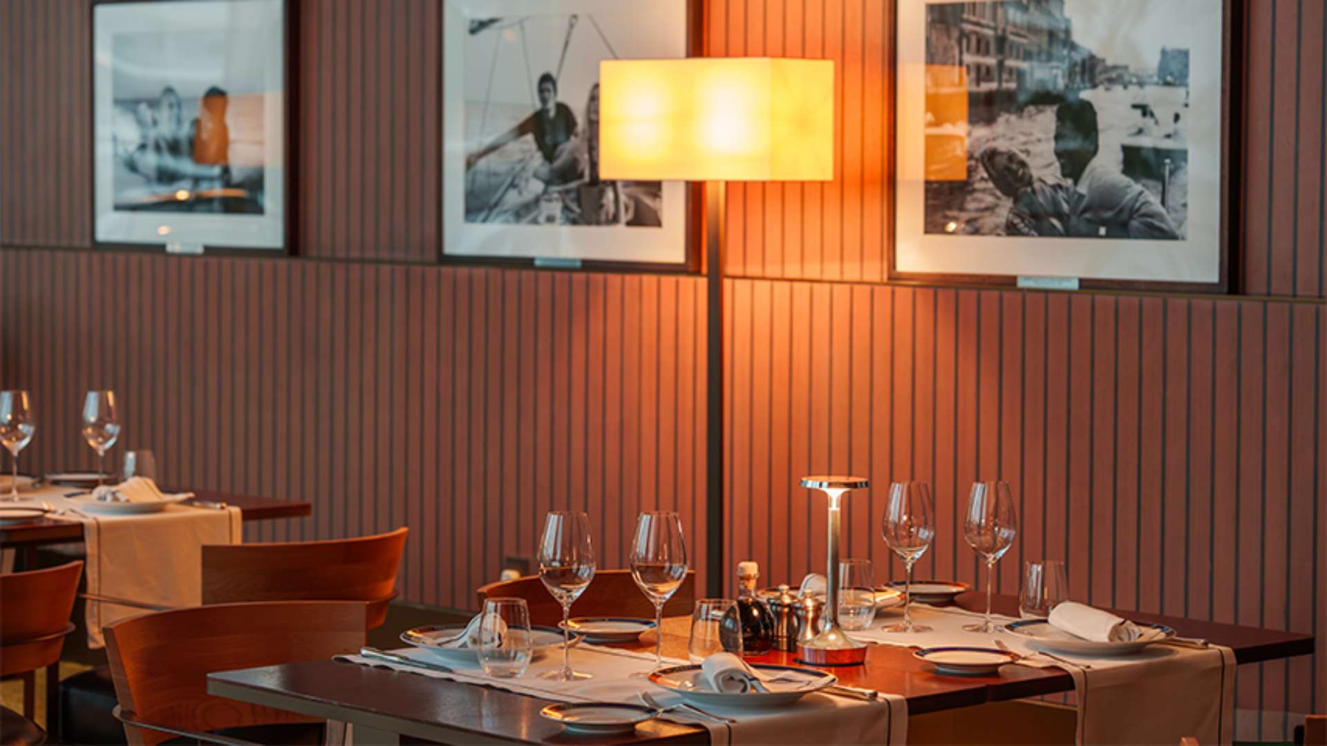 The elegant dining room of the Yacht Club Restaurant, specializing in Italian seafood with marina views.