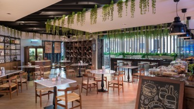 The warm and inviting interior of the IL Motto Italian deli and café.