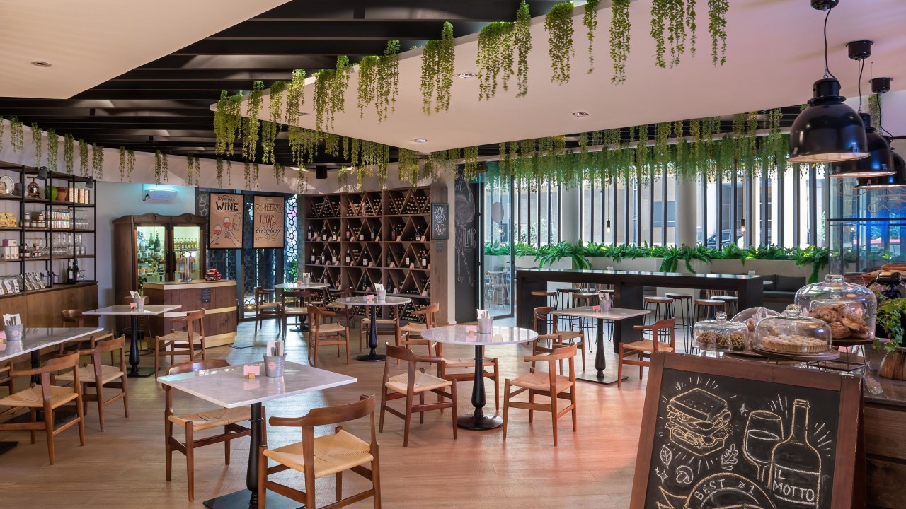 The warm and inviting interior of the IL Motto Italian deli and café.