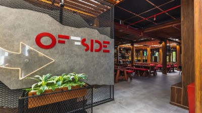 The main viewing area of Offside sports bar with large screens for live games.