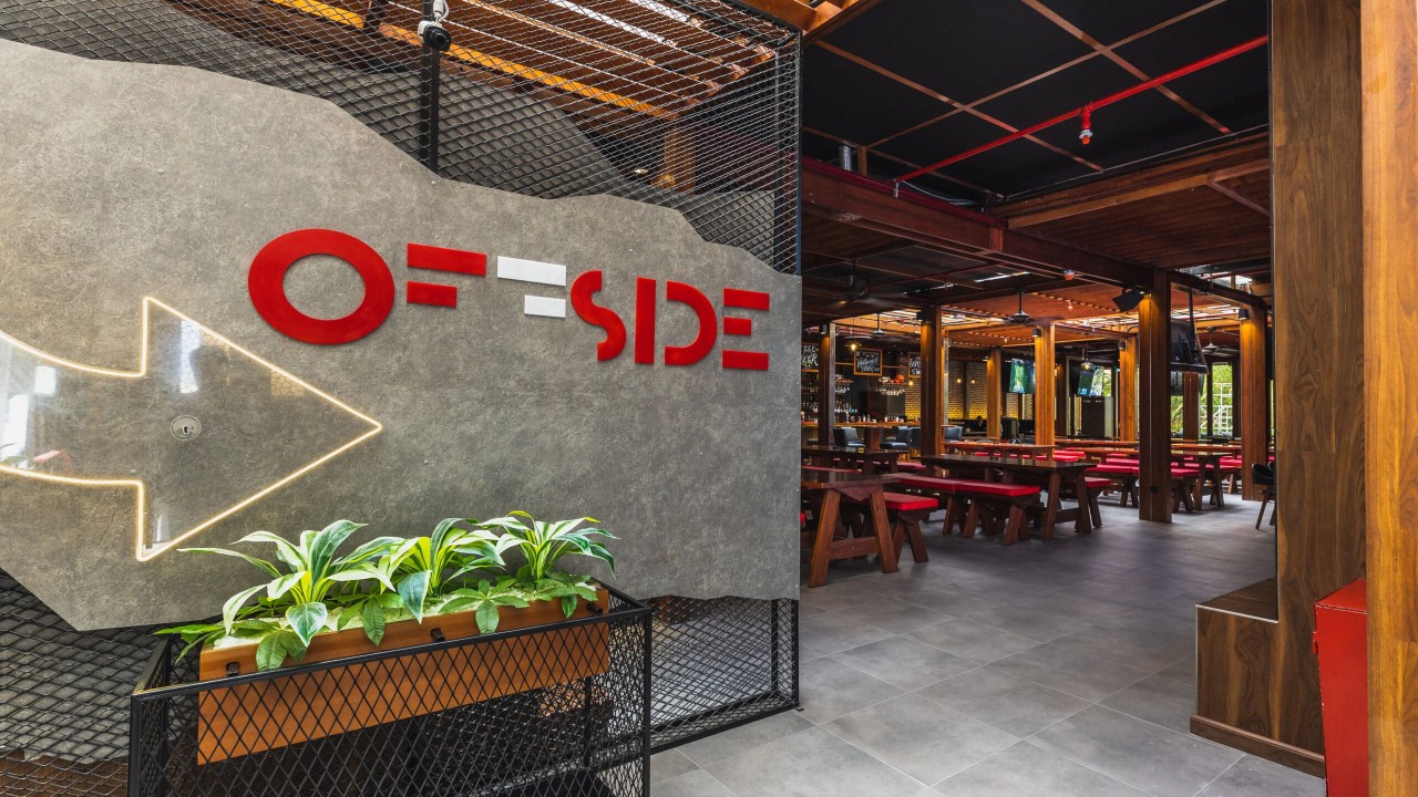 The main viewing area of Offside sports bar with large screens for live games.