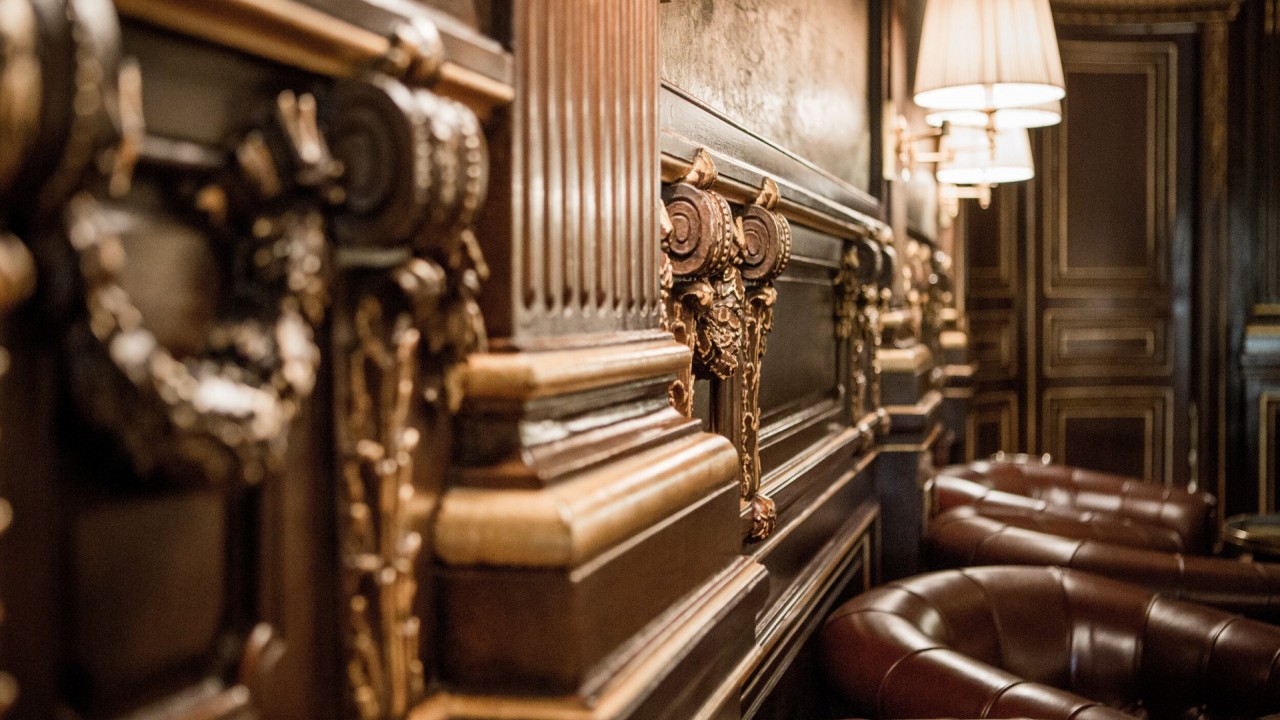 A detail of the sophisticated interior design and ambient lighting at Bar 228.