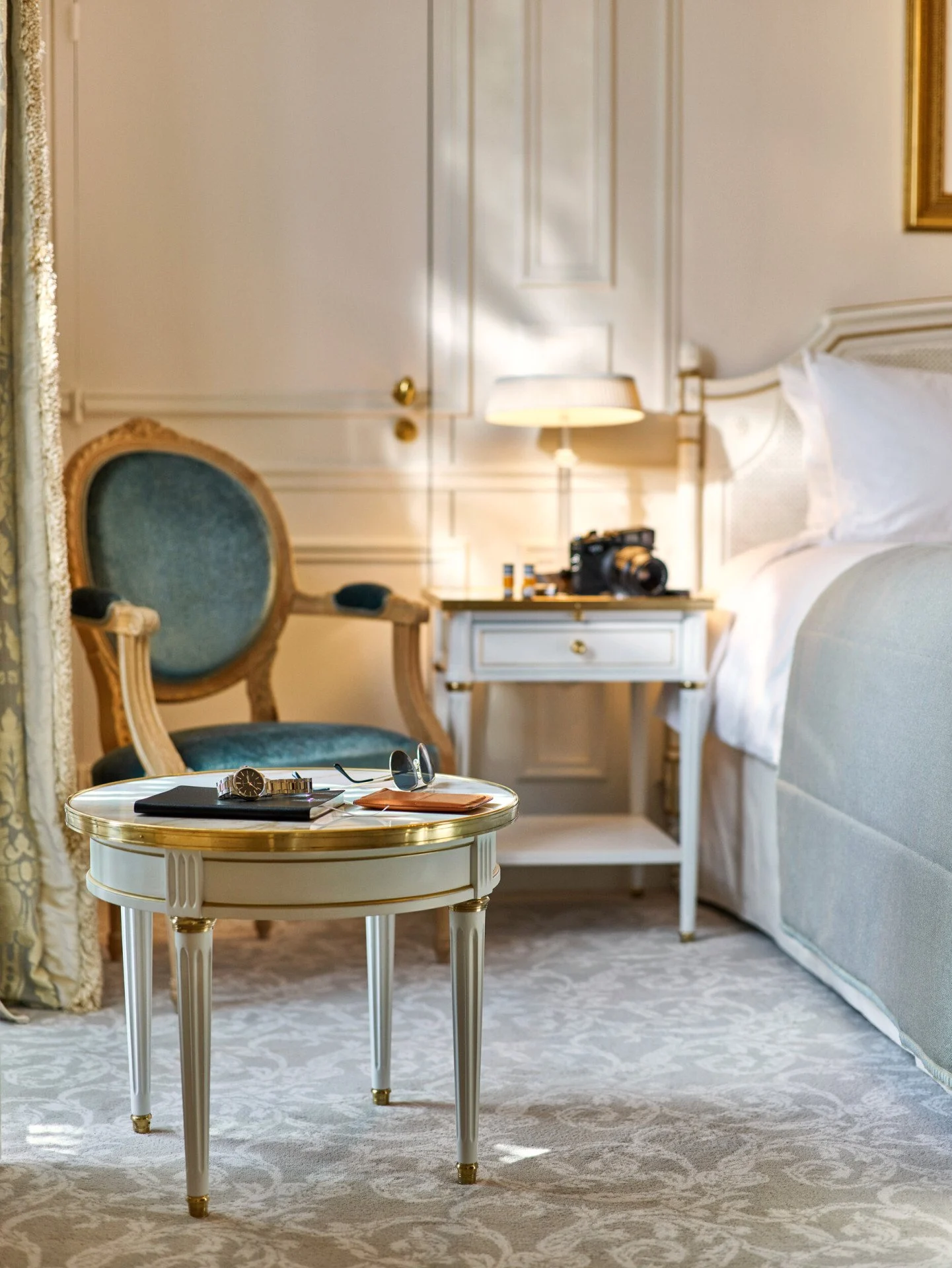 A detail of the luxurious bedding and bedside area in an Executive Room with Eiffel Tower view.