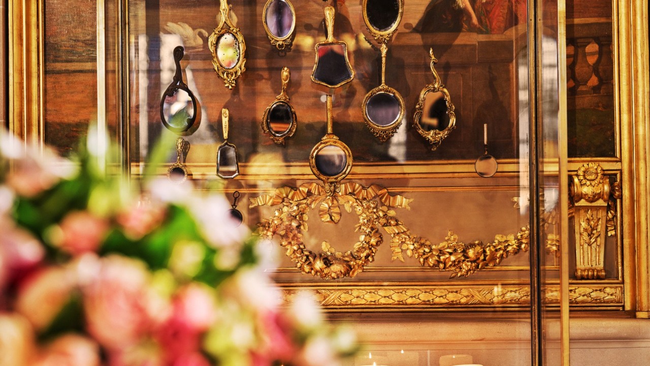 An artistic arrangement of decorative mirrors in the Le Meurice lobby, adding a playful touch.