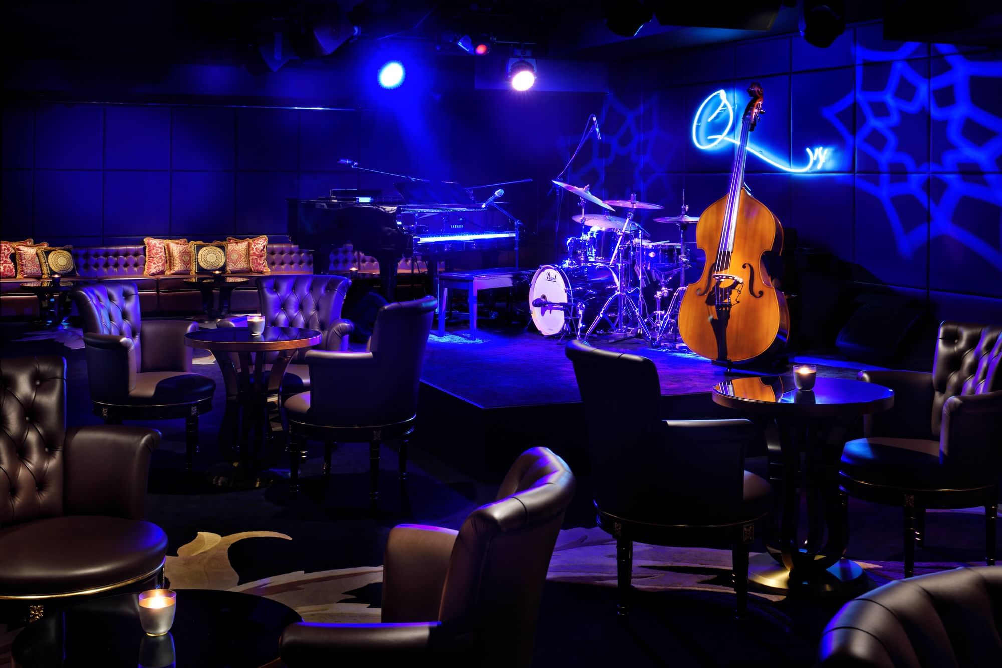 The lively karaoke and lounge area at Q's Bar, offering a versatile entertainment space.