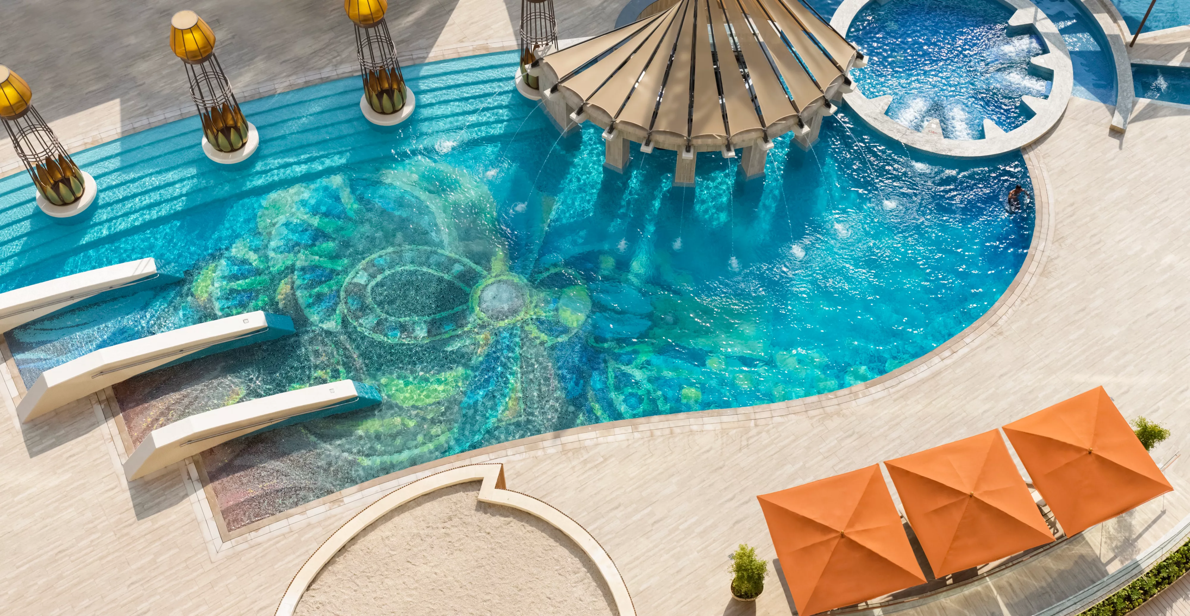 The serene 22-meter outdoor pool and relaxation area at Raffles Dubai.