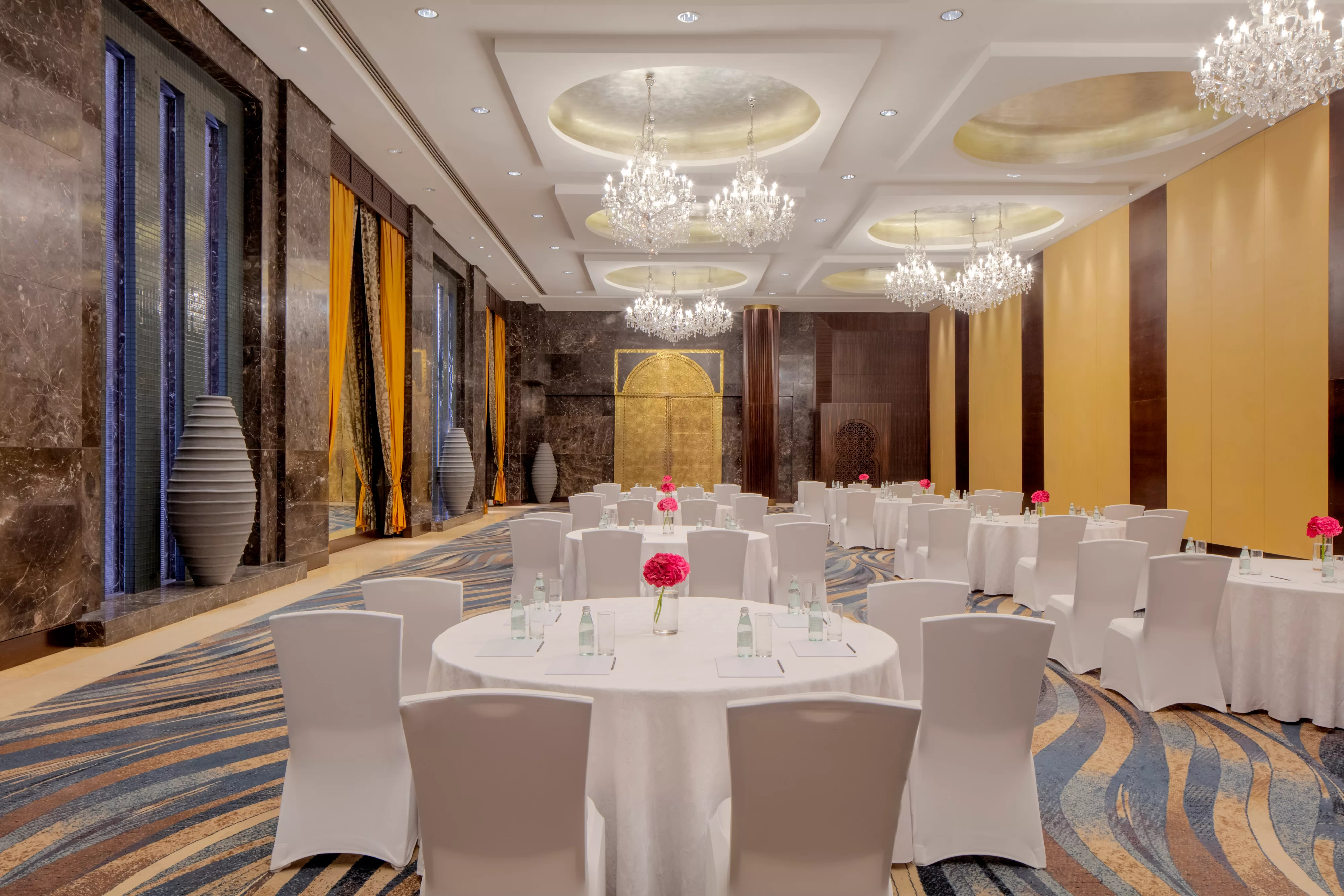 A beautifully prepared wedding venue in one of Raffles Dubai's elegant event spaces.