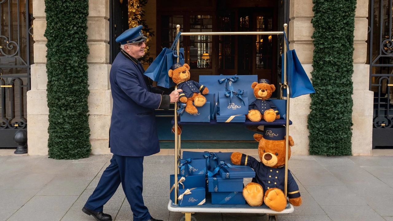 A Ritz Paris bellman carries exclusive hotel-branded products, including the new fitness and children's collections from the boutique.
