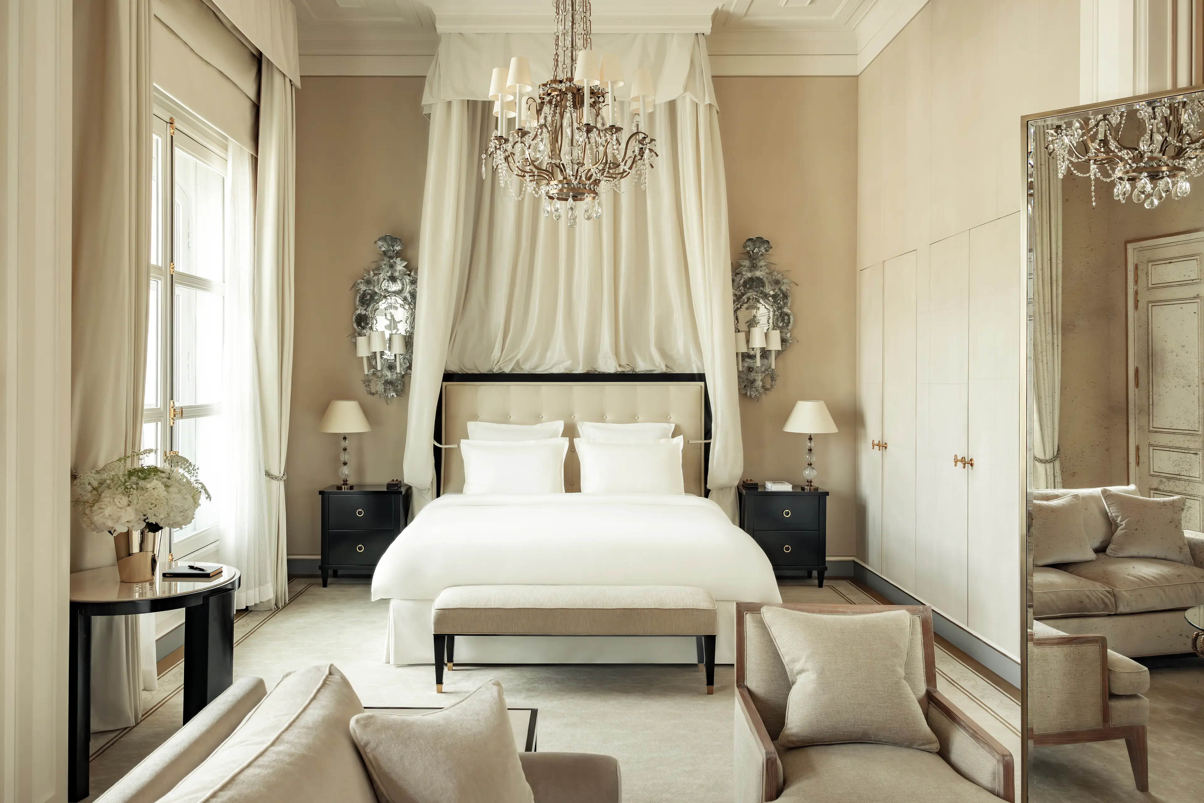 The timeless black, ivory, and white bedroom of the Suite Coco Chanel.