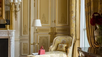 A sumptuous armchair in the Suite Impériale, exemplifying the suite's regal Napoleon III-inspired decor.