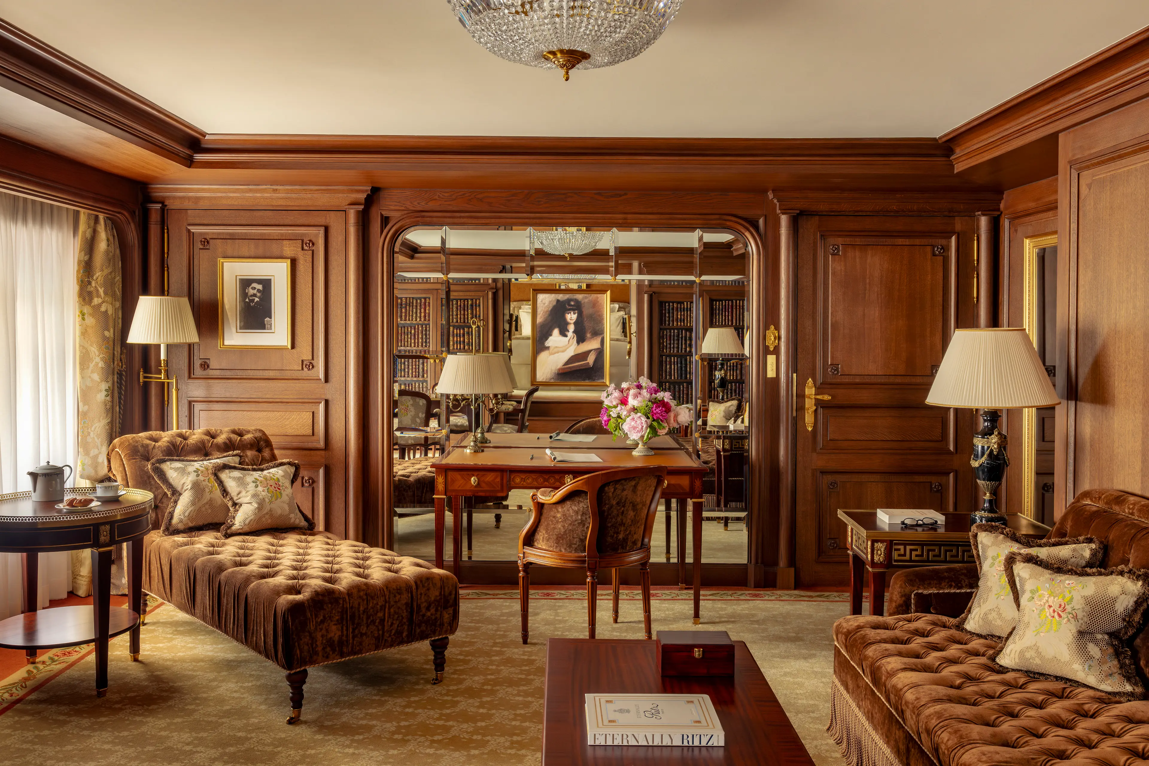 The cozy salon in the Suite Marcel Proust, featuring a chess set and tranquil decor.