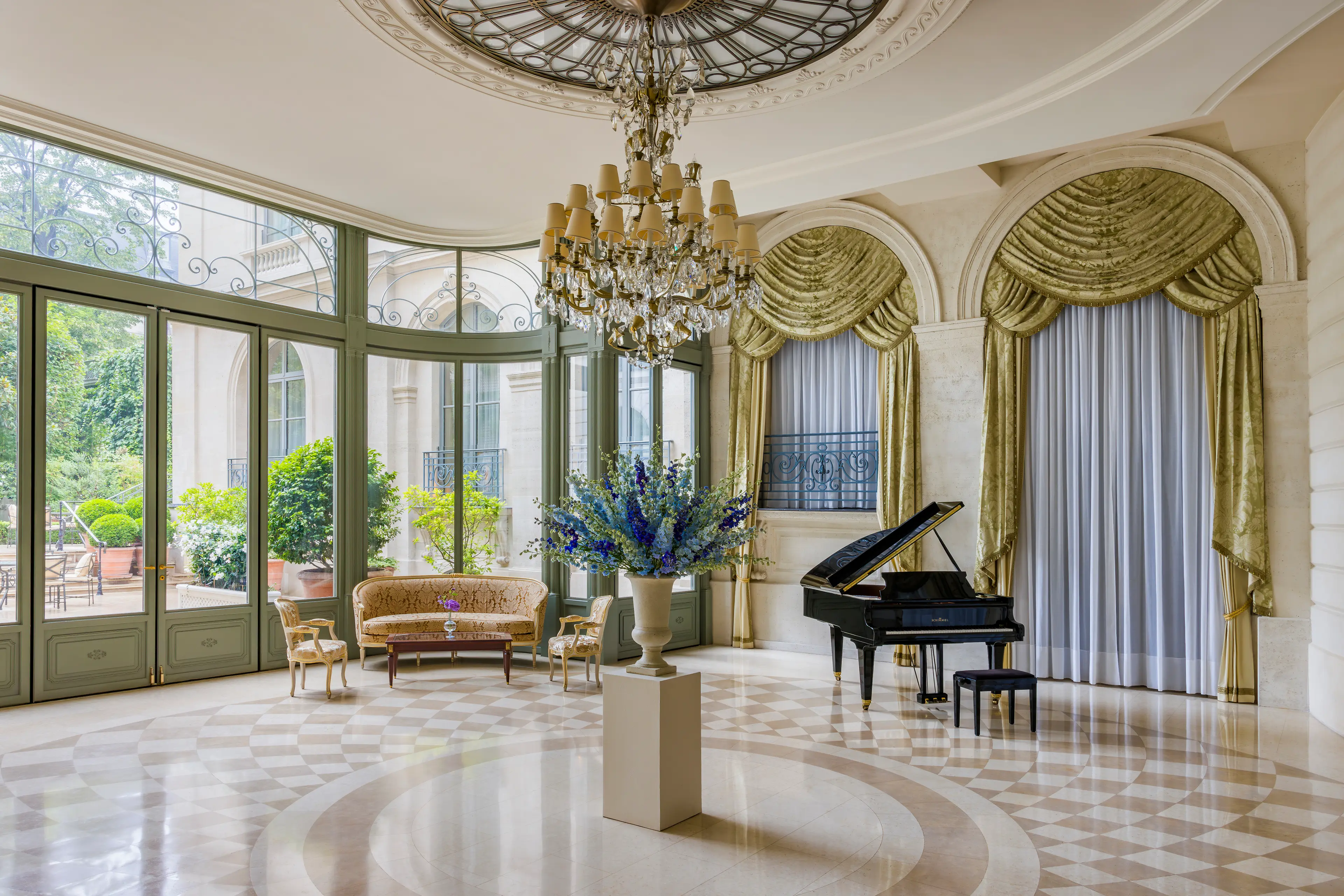 The light-filled Salon d'Été, with its glass roof and access to the terrace.