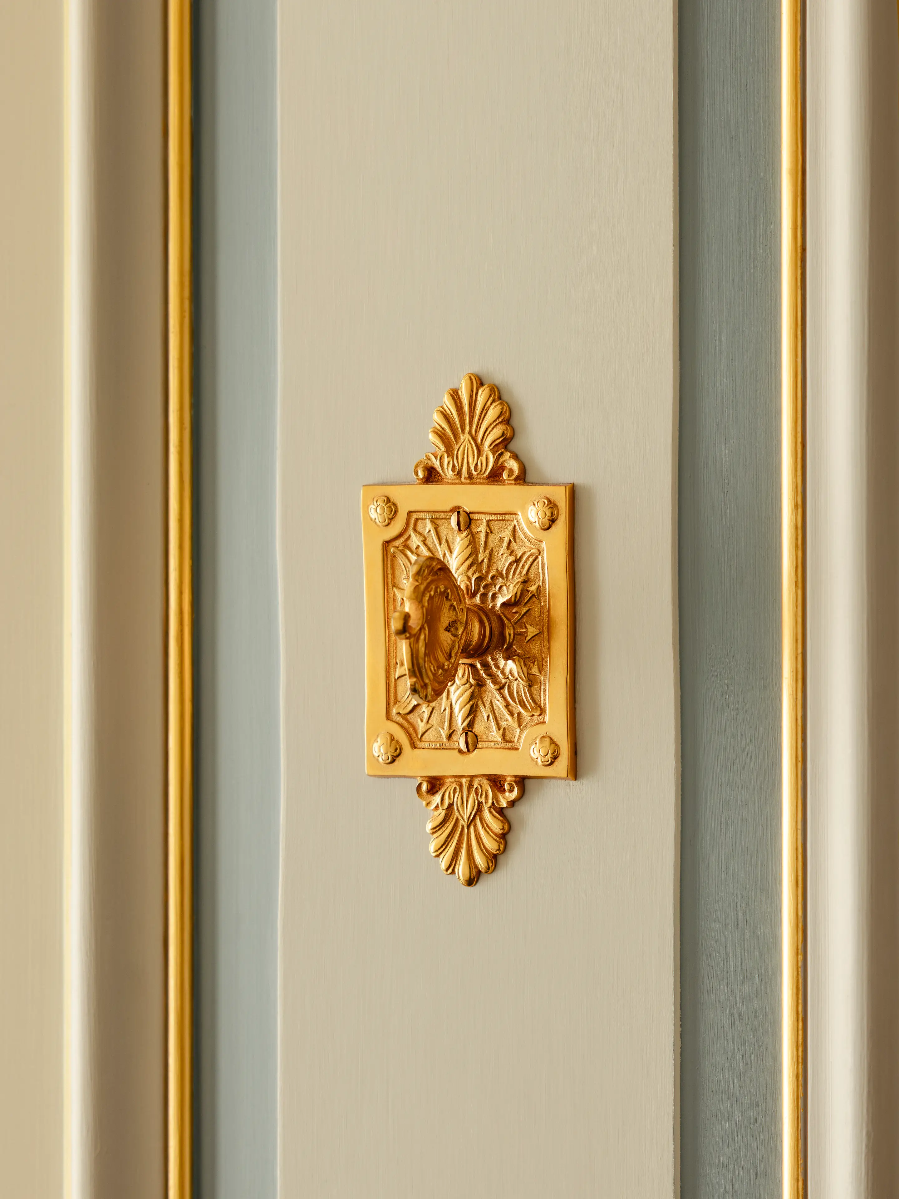 The iconic, lyre-shaped Ritz key, a symbol of the hotel's timeless elegance.